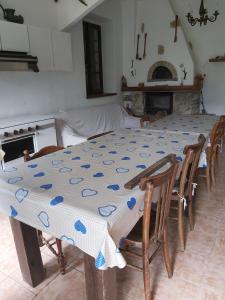 a table with a blue and white table cloth on it at Azzone Cascina nel verde in Azzone