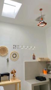 a room with white walls and a ceiling with a light at Homestay Pangandaran in Pangandaran