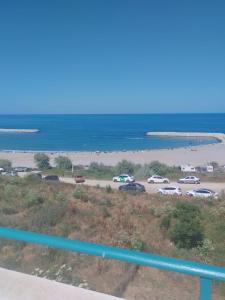 a parking lot with cars parked on the beach at Golful Lebedelor in Eforie Sud