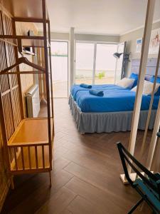 a bedroom with a bunk bed and a ladder at Studio LEIRIA Side in Leiria
