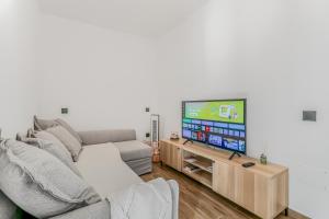 Μια τηλεόραση ή/και κέντρο ψυχαγωγίας στο Agaete Modern Holiday Home