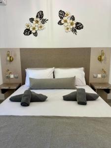 Ένα ή περισσότερα κρεβάτια σε δωμάτιο στο Sandi's House