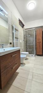 a bathroom with a sink and a toilet and a shower at Villa Maria in Trani +12 photos