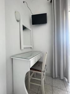 A television and/or entertainment centre at Agnàntema Portside Stays Skiathos
