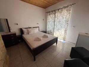 Postel nebo postele na pokoji v ubytování Ellas Hotel