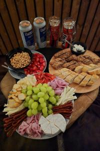 a table with a bunch of different types of food and drinks at Wellness Plus in Hrabŭvka +9 photos