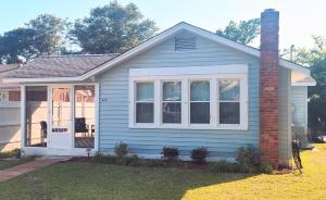 a small blue house with a brick chimney at Crescent Vintage Cottage in Myrtle Beach
