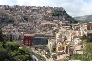 a cityscape of a city with buildings and trees at Amaca Iblea in Ragusa