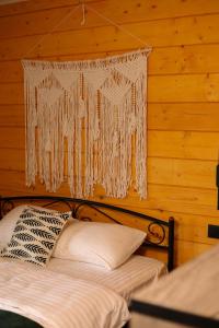a bedroom with two beds and a chandelier at Busko Residence in Staryy Mizunʼ