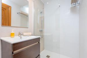 a bathroom with a sink and a shower at Can Joan in Cala Figuera +27 photos