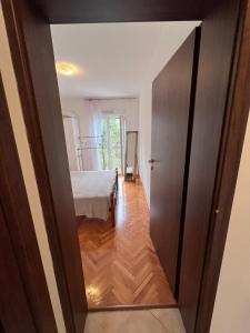 Postel nebo postele na pokoji v ubytování Apartments "Helios"