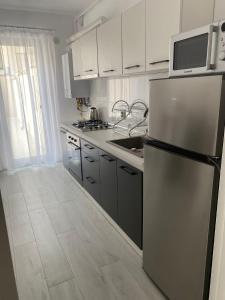 Dapur atau dapur kecil di Luma Apartment Sibiu