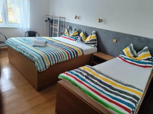 Postel nebo postele na pokoji v ubytování Rekreačný dom Railip