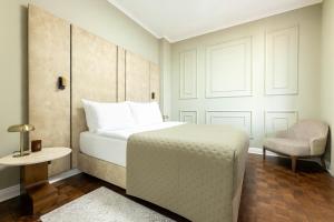 Postel nebo postele na pokoji v ubytování Hotel Majestic