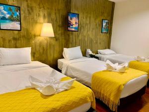 Ένα ή περισσότερα κρεβάτια σε δωμάτιο στο The City Yaowarat Hotel +83 φωτογραφίες