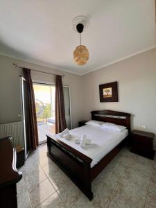 Ένα ή περισσότερα κρεβάτια σε δωμάτιο στο Casa Psarou 1