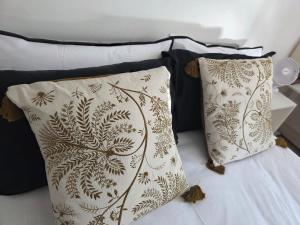 a bed with two pillows on top of it at Walk to Wembley Stadium and Arena 2 Bedroom Sleeps 4 in London +15 photos