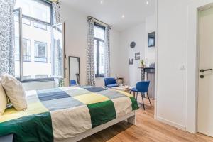 Ένα ή περισσότερα κρεβάτια σε δωμάτιο στο Spacious 6 Bedroom Apartment in the Heart of Ghent