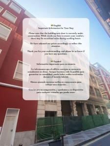 een bord aan de zijkant van een gebouw bij Luxury City Center Apartment by NRAS in Alicante