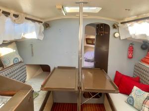 a small room with a table in a caravan at Voilier à Porquerolles in Hyères