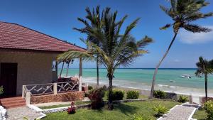 a house with a view of the beach at Mandarin Resort Zanzibar in Kizimkazi