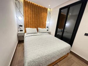 Voodi või voodid majutusasutuse Bel appartement 2 chambres au coeur de Gueliz toas