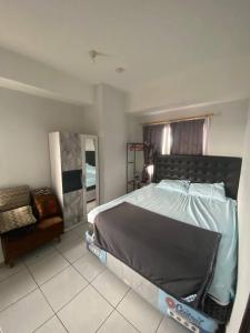 Voodi või voodid majutusasutuse Apartement m square cibaduyut toas