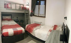 A bed or beds in a room at Dolomites Holiday Home