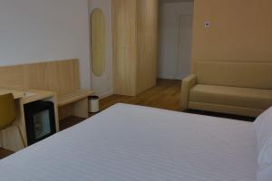 Postel nebo postele na pokoji v ubytování SH Campus Lyceum