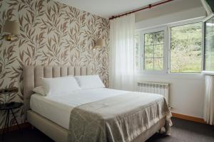 Postel nebo postele na pokoji v ubytování Hotel San Jorge + 37 fotografií