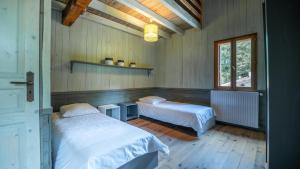 Postel nebo postele na pokoji v ubytování Moulin de Sore - A louer en gîte ou chambres d'hôtes dans un lieu naturel préservé