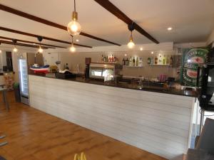 a bar in a restaurant with a counter at Cardiff Hotel in Marina di Camerota