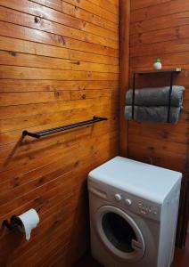 a bathroom with a washing machine and a toilet at Mike's Lodge Sodwana Bay in Sodwana Bay +31 photos