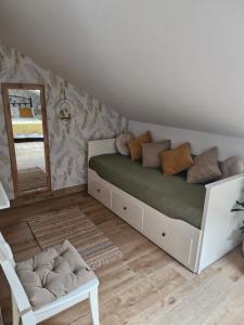 a bedroom with a bed and a mirror at "La casuca de Finu" #2# Santillana del Mar in Santillana del Mar