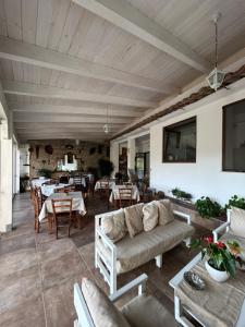 a living room with a couch and a table at Bed e Breakfast Erica in Conflenti Inferiore
