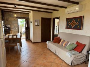 a living room with a couch and a table at Retiro de Basto in Celorico de Basto