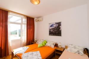 Posteľ alebo postele v izbe v ubytovaní Apartments Mamma Mia + 37 fotografií