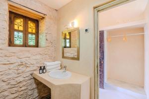 a bathroom with a sink and a window at Villa Sultana by Living Essaouira in Essaouira +47 photos