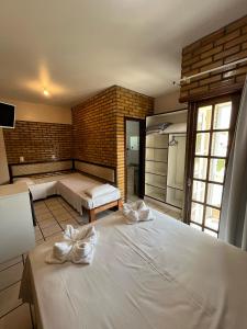 Ein Bett oder Betten in einem Zimmer der Unterkunft Hotel D'Luz