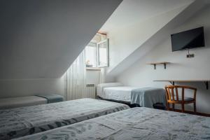 Postel nebo postele na pokoji v ubytování Hotel San Jorge