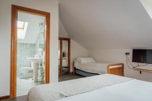Postel nebo postele na pokoji v ubytování Hotel San Jorge