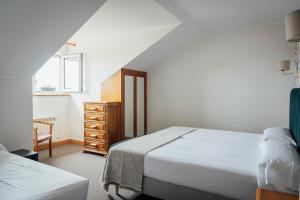 Postel nebo postele na pokoji v ubytování Hotel San Jorge