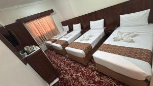 Letto o letti in una camera di فندق غالب المشاعر