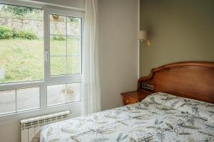 Postel nebo postele na pokoji v ubytování Hotel San Jorge