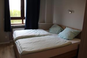 Postel nebo postele na pokoji v ubytování Hotel Garni Postkutsche