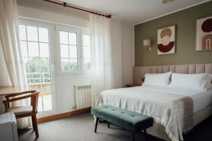 Postel nebo postele na pokoji v ubytování Hotel San Jorge