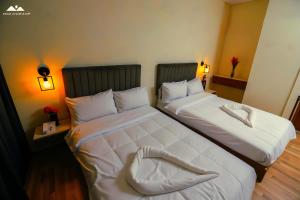Ένα ή περισσότερα κρεβάτια σε δωμάτιο στο SOFiA PYRAMiDS & SPHiNX HOTEL free pool access