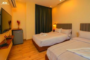 Ένα ή περισσότερα κρεβάτια σε δωμάτιο στο SOFiA PYRAMiDS & SPHiNX HOTEL free pool access