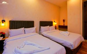 Ένα ή περισσότερα κρεβάτια σε δωμάτιο στο SOFiA PYRAMiDS & SPHiNX HOTEL free pool access