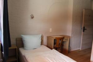 Postel nebo postele na pokoji v ubytování Hotel Garni Postkutsche